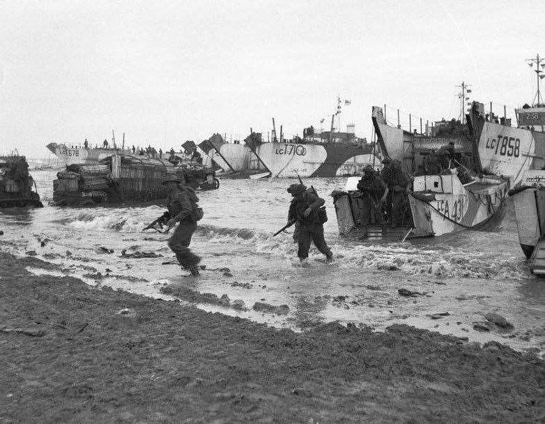Image 3- British commandos landing on Gold Beach in Normandy on June 6, 1944. Public DomainOnline it says: This work created by the United Kingdom Government is in the public domain.This is because it is one of the following: It is a photograph taken prior to 1 June 1957; It was published prior to 1974; It is an artistic work other than a photograph or engraving (e.g. a painting) which was created prior to 1974.