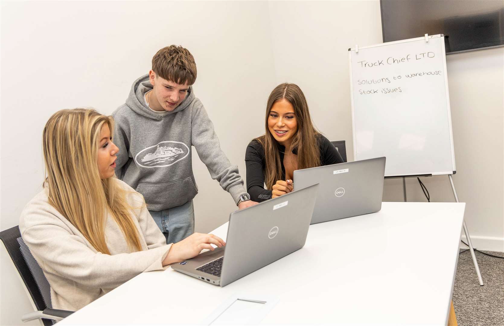 T-Level business students Gabriella Currie, Oscar Parkinson and Bella Rogerson