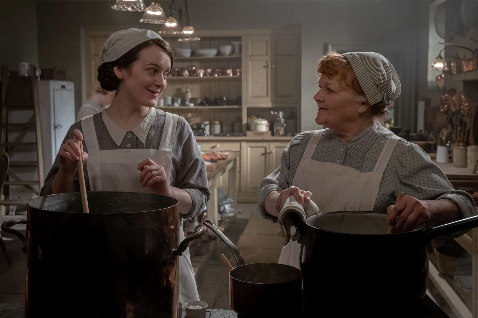 Sophie McShera stars as Daisy and Lesley Nicol stars as Mrs. Patmore in DOWNTON ABBEY: A New Era, a Focus Features release. Credit: Ben Blackall / © 2021 Focus Features, LLC (56442267)