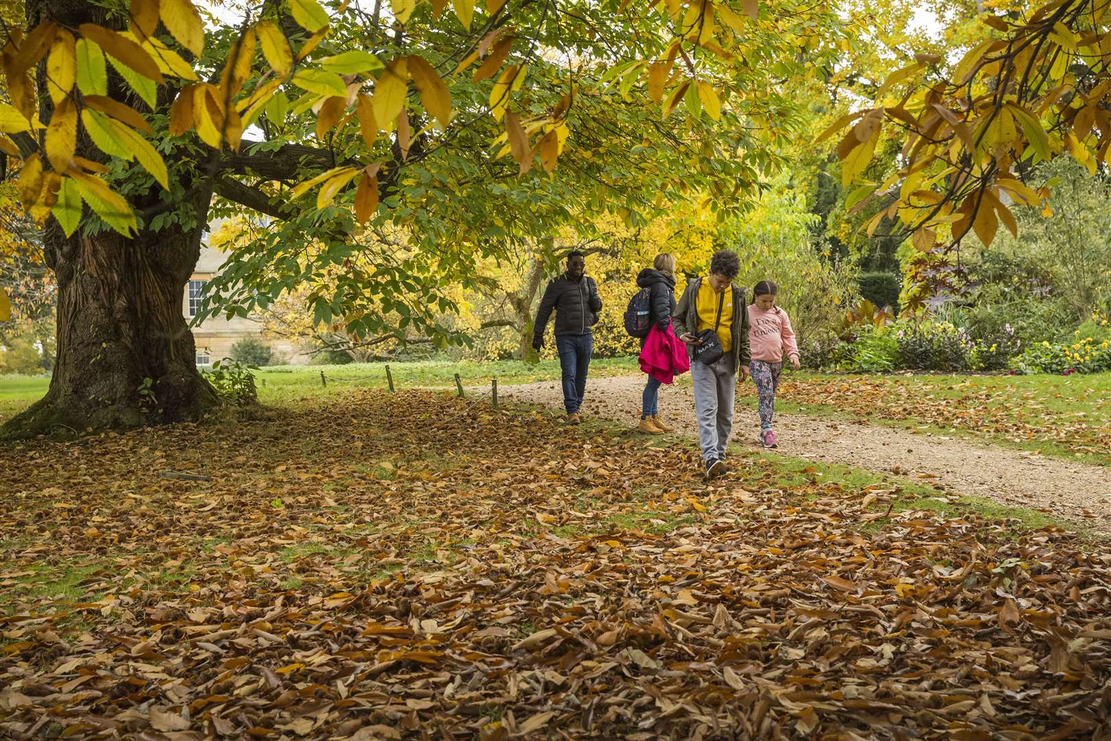 Visitors walking in the gardens at Basildon Park Picture: NT James Dobson