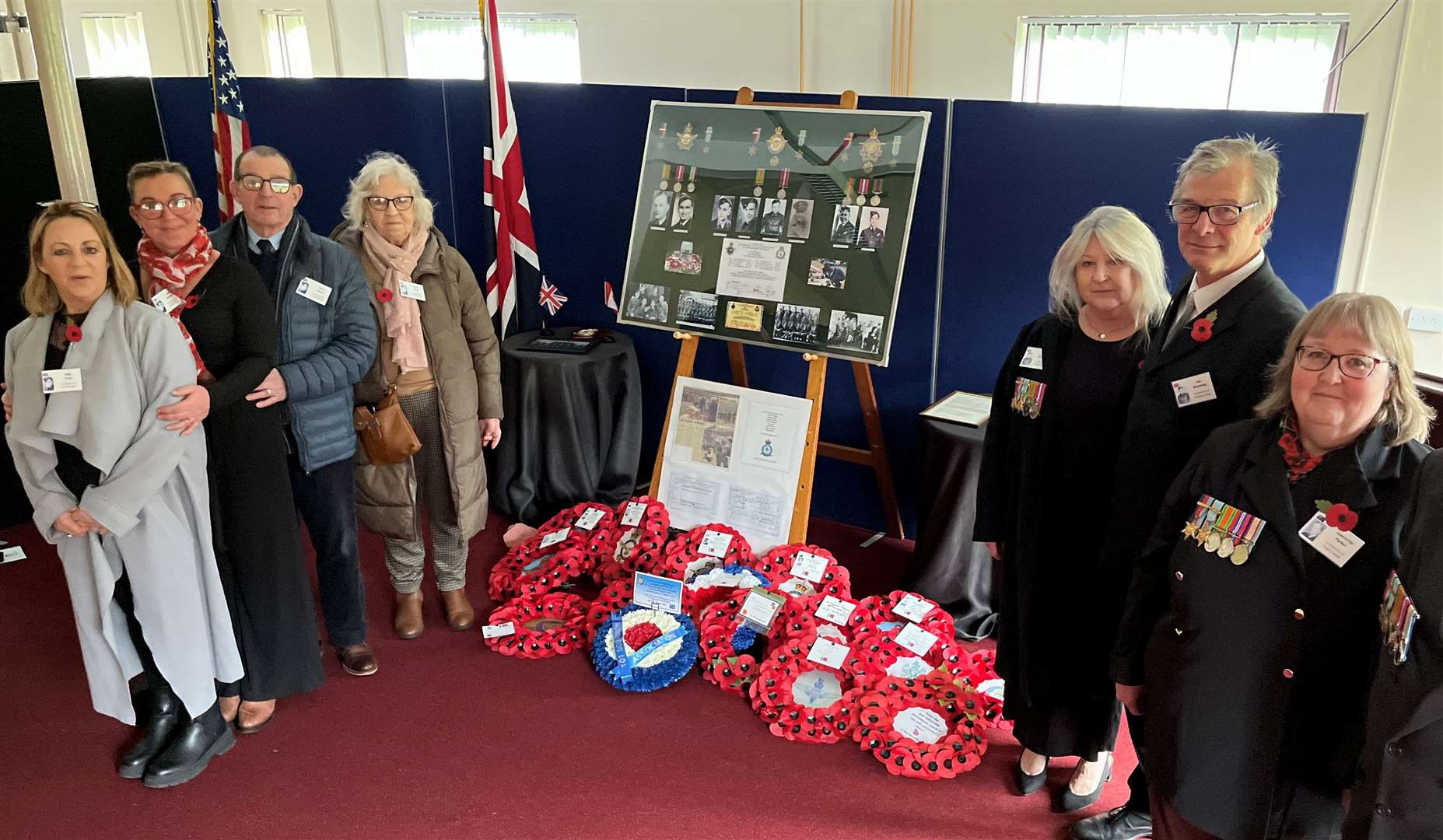 Family of deceased airmen at the memorial service. L to R: Sally Long, Keely Boulton and Bryn and Lynda Jones (representing Sgt Donald Addy); Keri and Ian Brunning (representing Sgt Richard Collier); and Jeannette Parker (representing Flt Sgt Hugo Traeger). Credit: Mirek Gosney