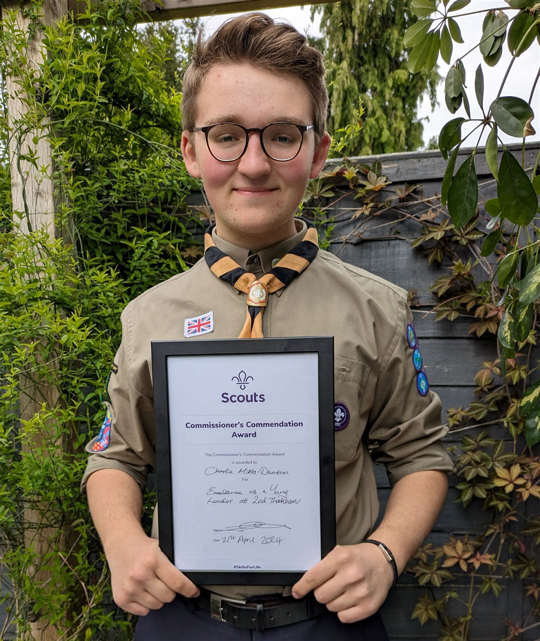Charlie with his Commissioner's Commendation Award he received as a young scout leader in April. Credit: Julie Miklos-Denton