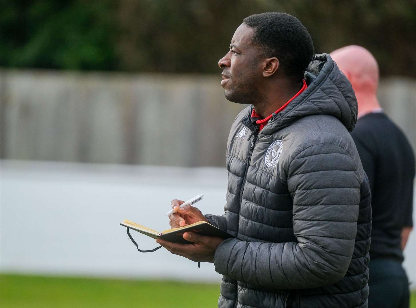 Boss Yashwa Romeo watches on and takes notes