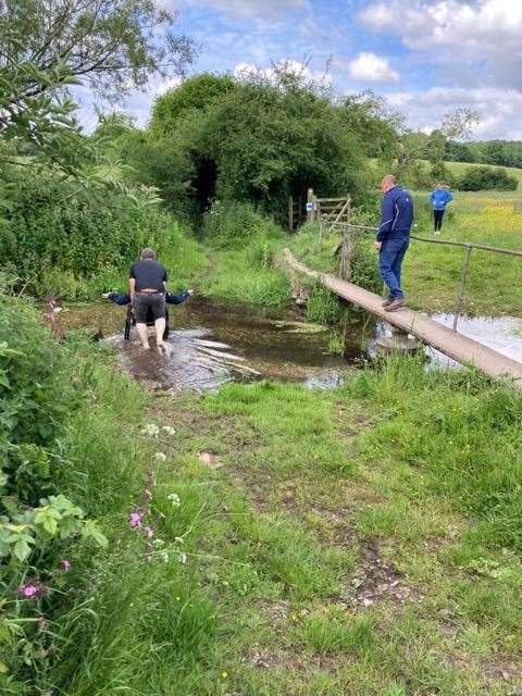 Jemima travelling across the ford in her wheelchair during the Newbury RDA's sponsored walk