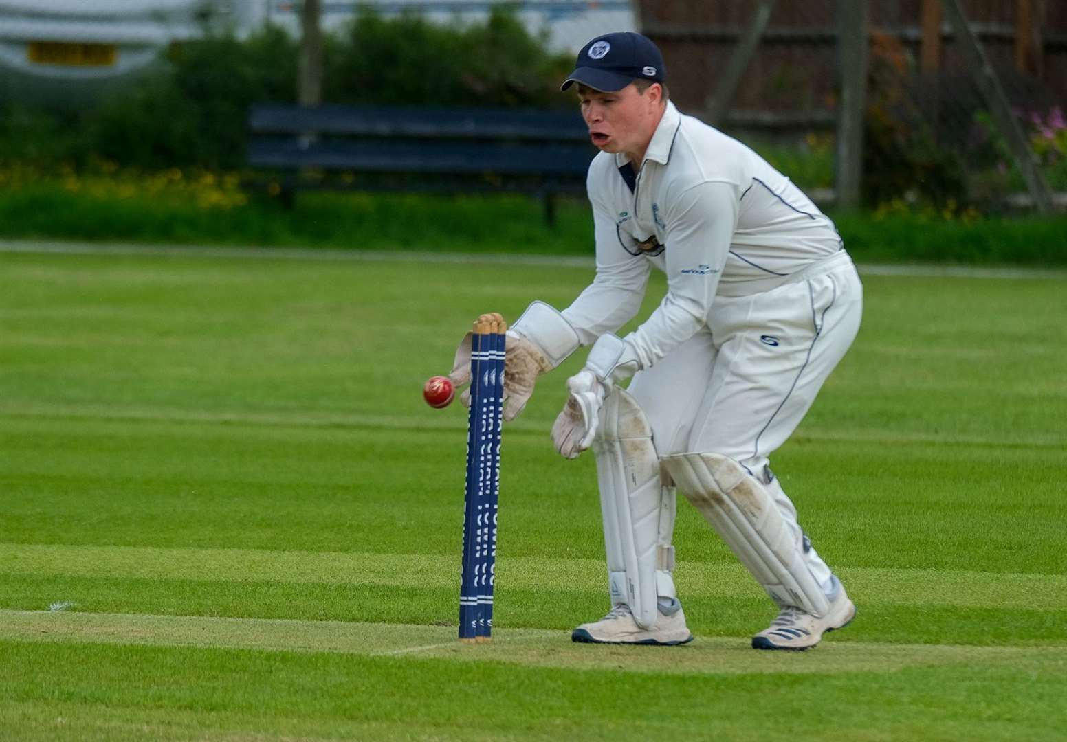 Jamie Young in action behind the stumps