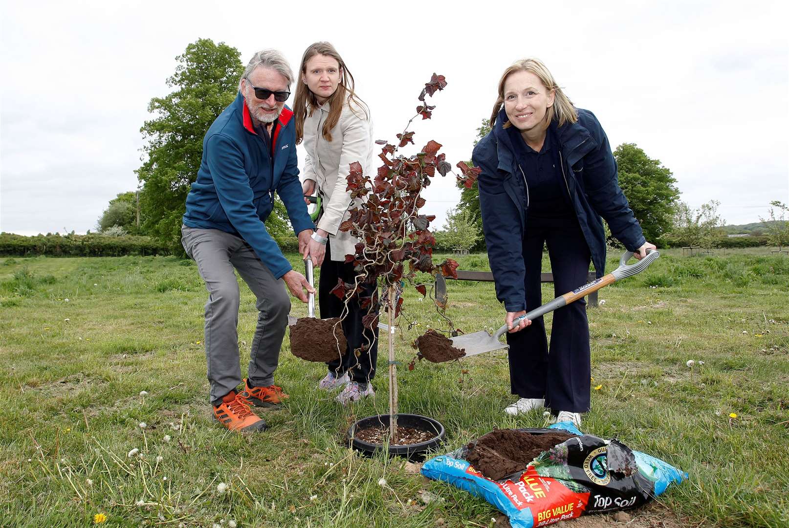 Staff member Lynsey, former Prior's Court pupil Jenny and her dad Mark. Credit: Louise Bellaers