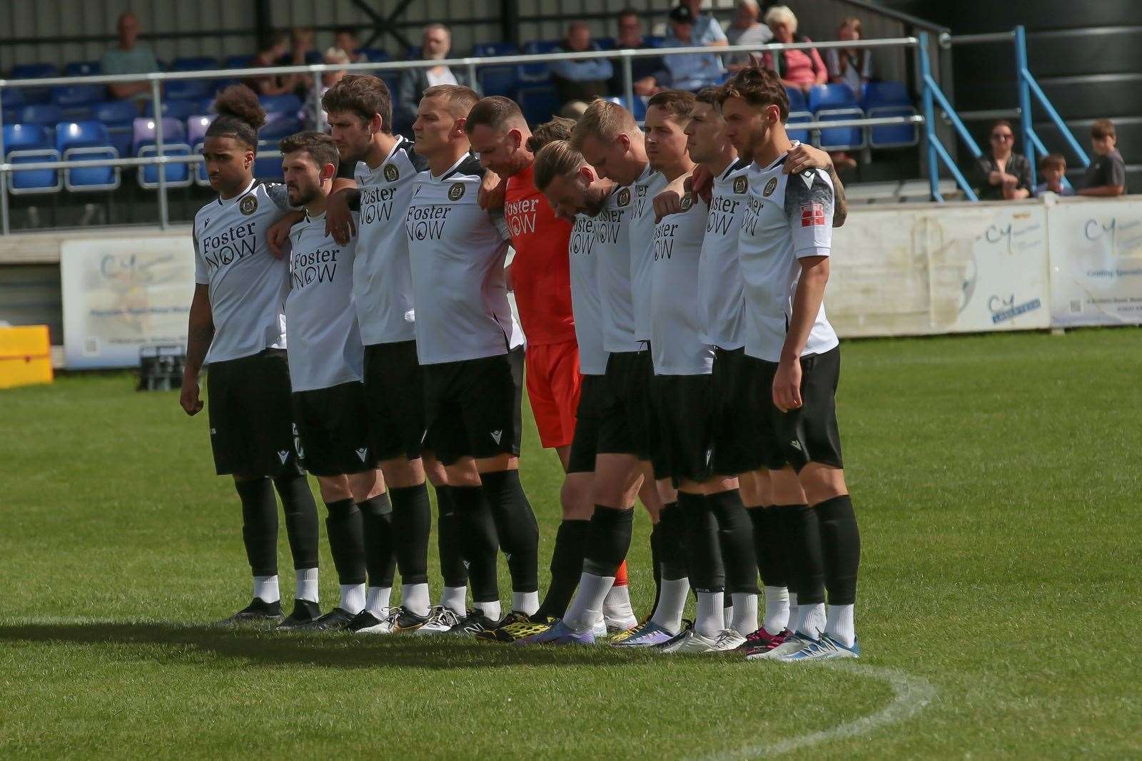 Hungerford players observe a minute's silence. All pictures by Jeff Youd