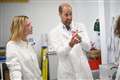 Prince of Wales and Cate Blanchett don lab coats to see eco brand at work