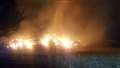 Crews spend all night tackling huge hay bale fire in Wash Common