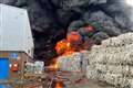 Black smoke seen as firefighters tackle large fire at recycling warehouse
