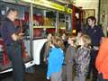 Brownie's get a helping hand from Red Watch on their quest for first aid badge