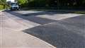 Council accused of 'penny-pinching' over partial road repairs