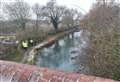 Divers search car submerged in icy waters