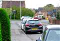 Parked cars block council painting double yellow lines on road