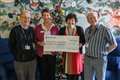 Thatcham photographers present charity cheque