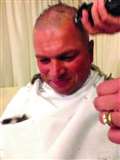 Golf captain has close shave for charity