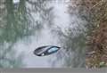 Car plunges into icy canal