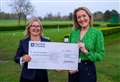 Golf club donates whopping figure to two charities