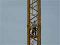 Parkway drama as man talked down from crane after 2 hour stand-off