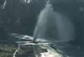Burst water main showers road