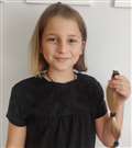 Imogen raises £500 by getting long locks chopped off