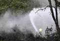 Firefighters battle woodland blaze
