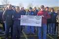 Classic vehicle club members present donation