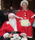 Santa and his in-law helper at Englefield House charity Christmas tea party