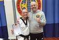 Roth becomes taekwondo Master, fourth Dan