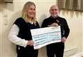 Village society presents cheque of more than £1,500 to mental health charity