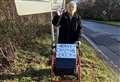 Woman spreads festive cheer to drivers
