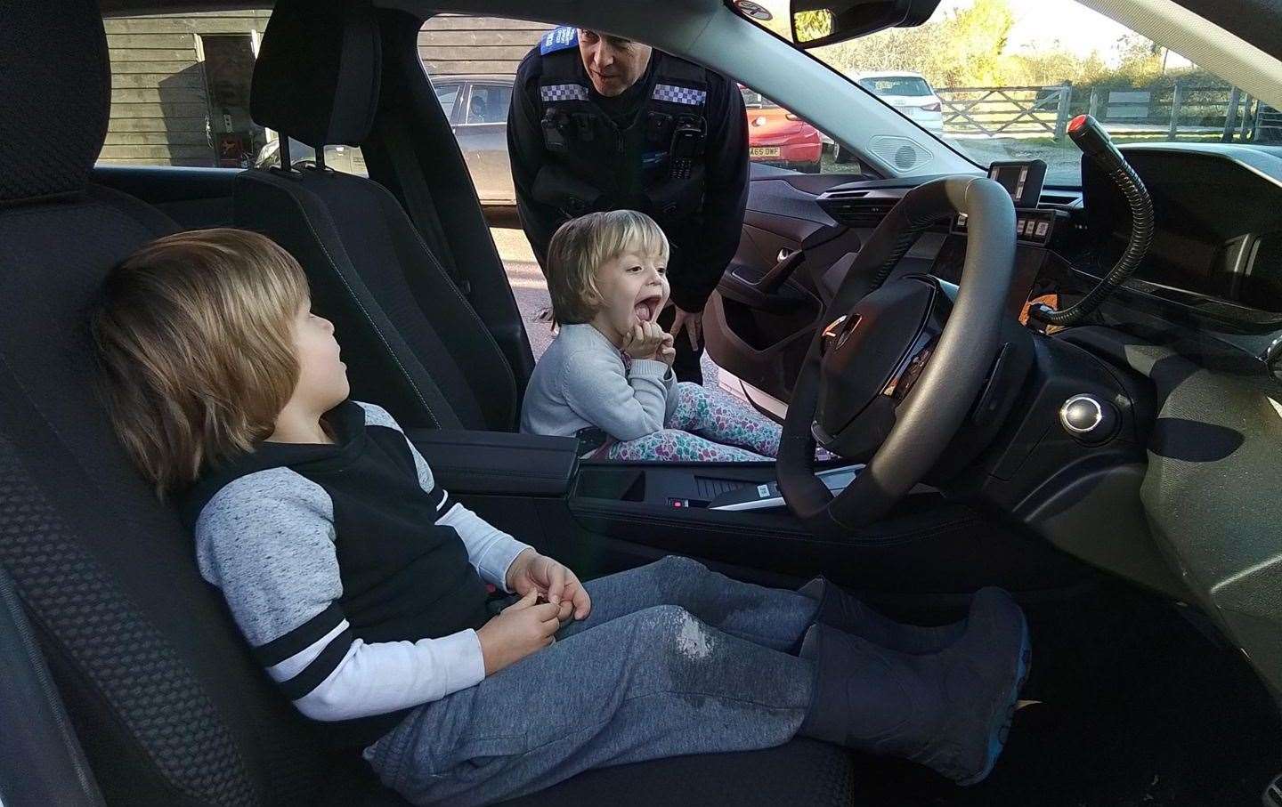 Pupils get a tour of inside a police car
