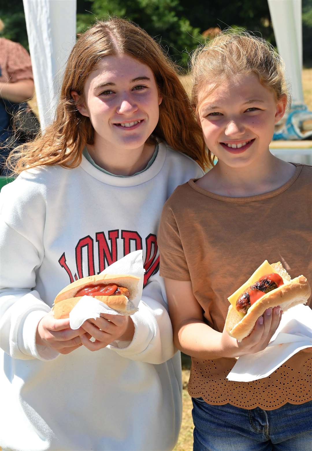 Eleanor (13) & Bethan Strong (10) enjoying some hot dogs