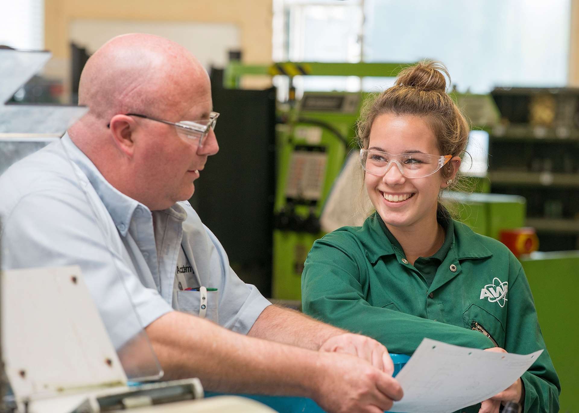 Apprentice Ashleigh Barbour talks with instructor Andy Salter