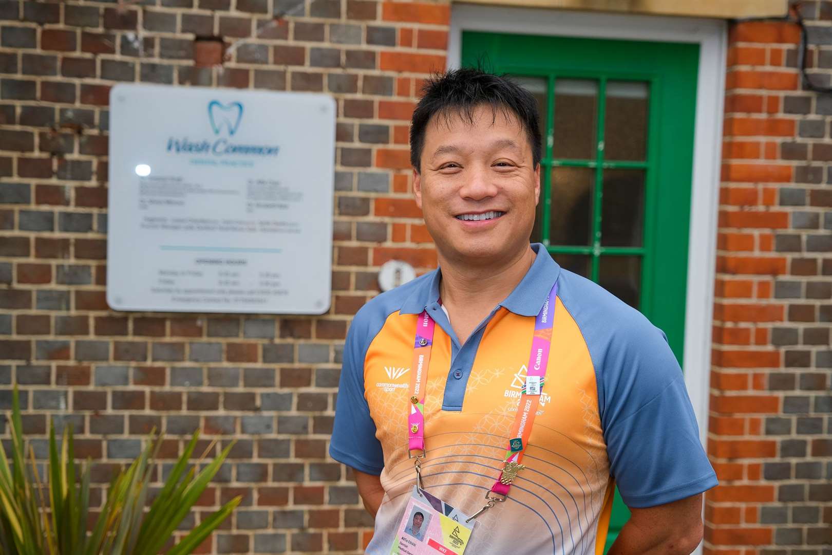 Alfie Chan is working as a voluntary dentist at the Commonwealth Games