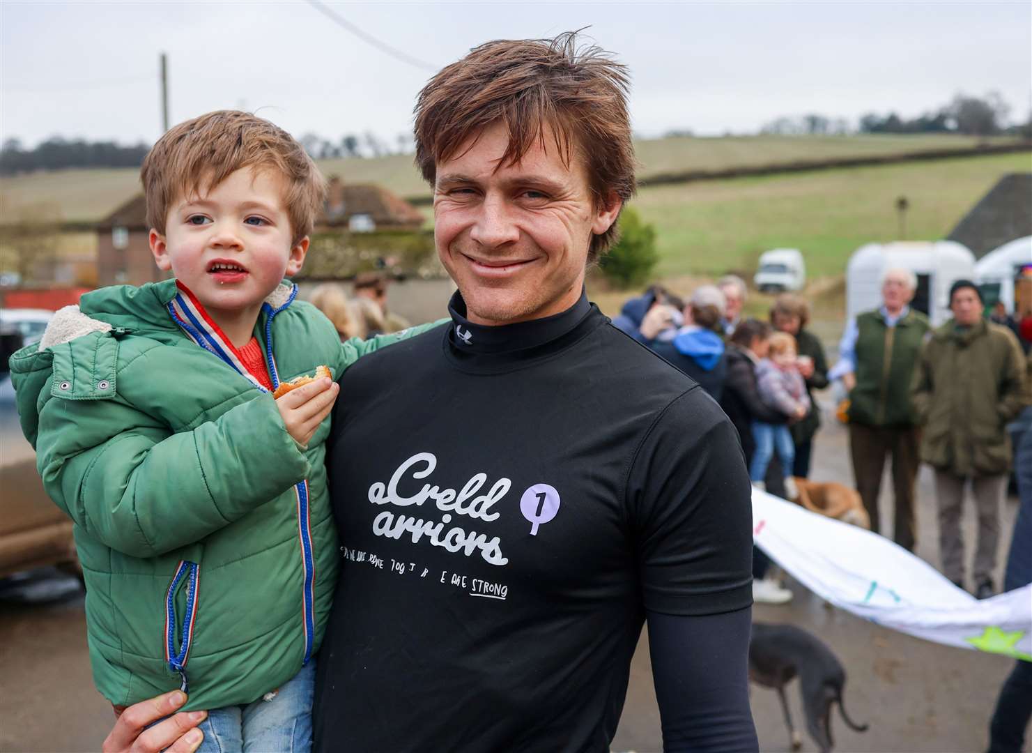 Oli with Angus after he finished the seven marathon challenge