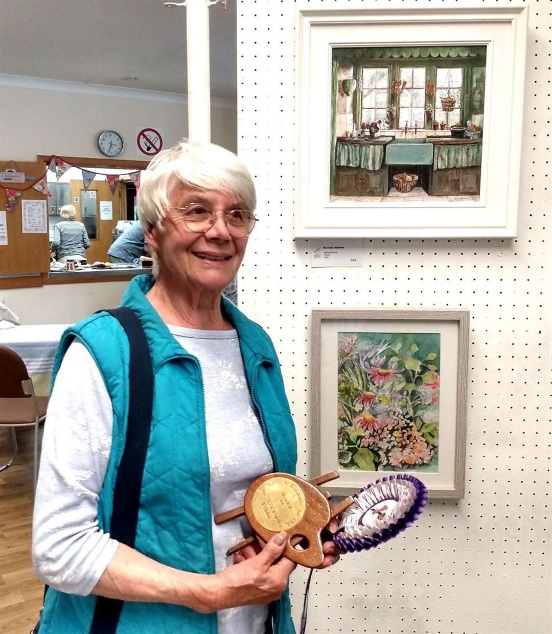 Jenny Kennish with her picture Nans kitchen behind her