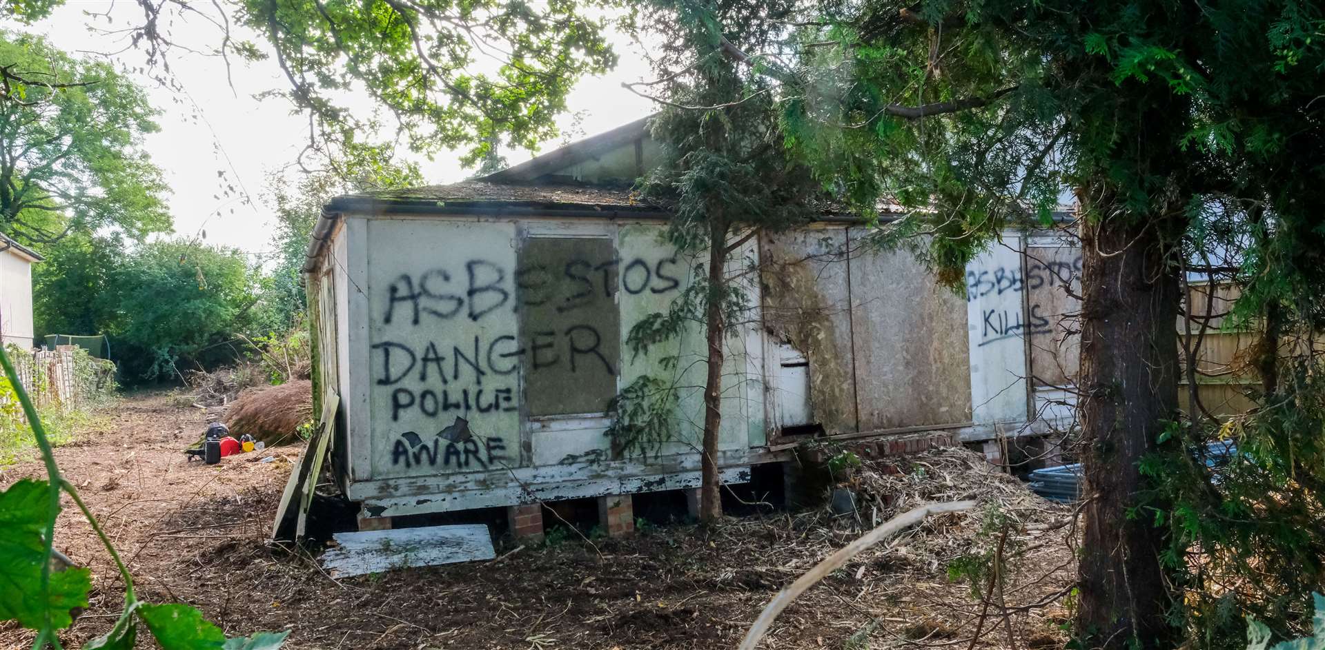 The derelict property at 7 Mapledurham Drive in Purley-on-Thames. Fencing now surrounds the property