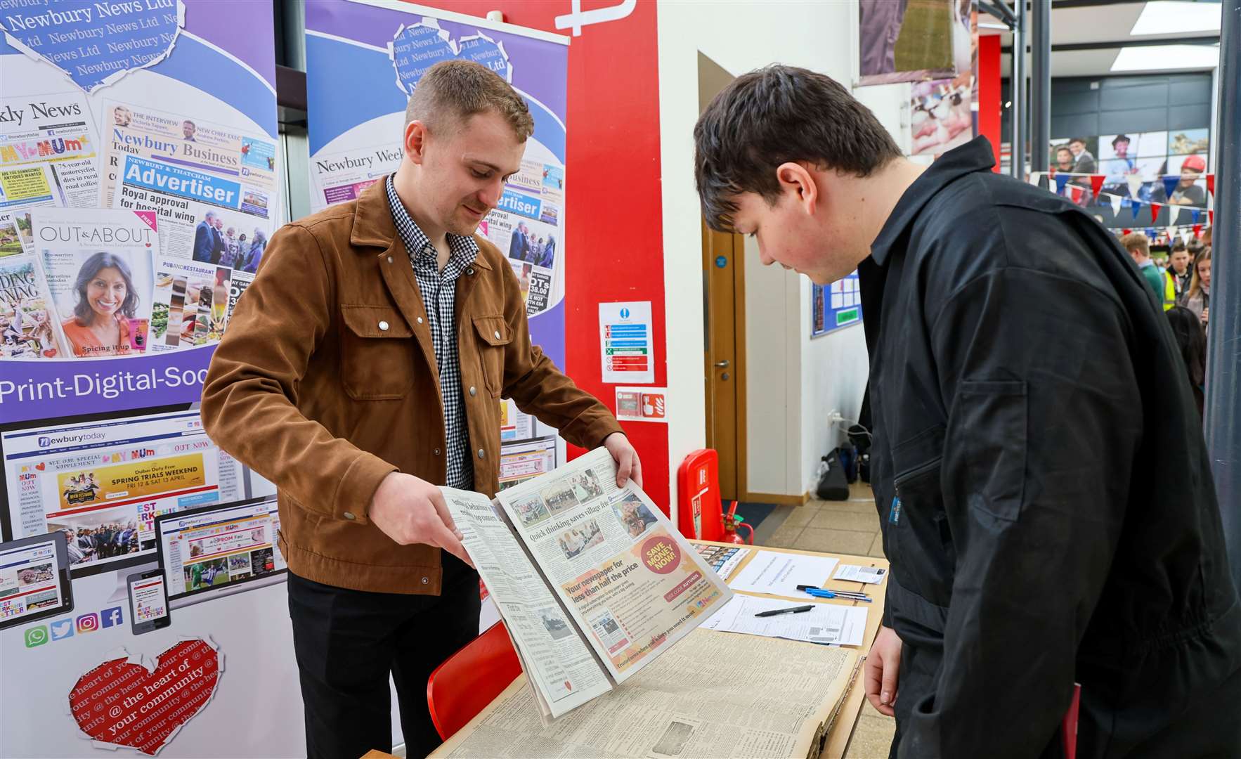 Student visiting the Newbury Weekly News stand