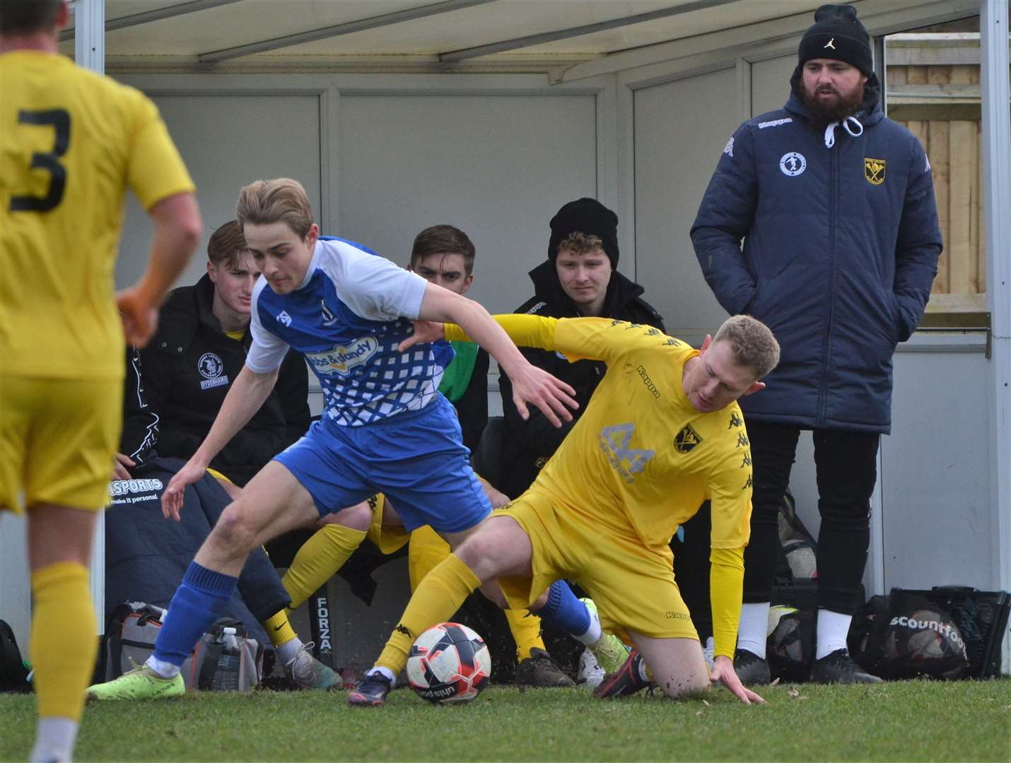 Jack French battles for the ball with joint-manager Ben Dillon watching on