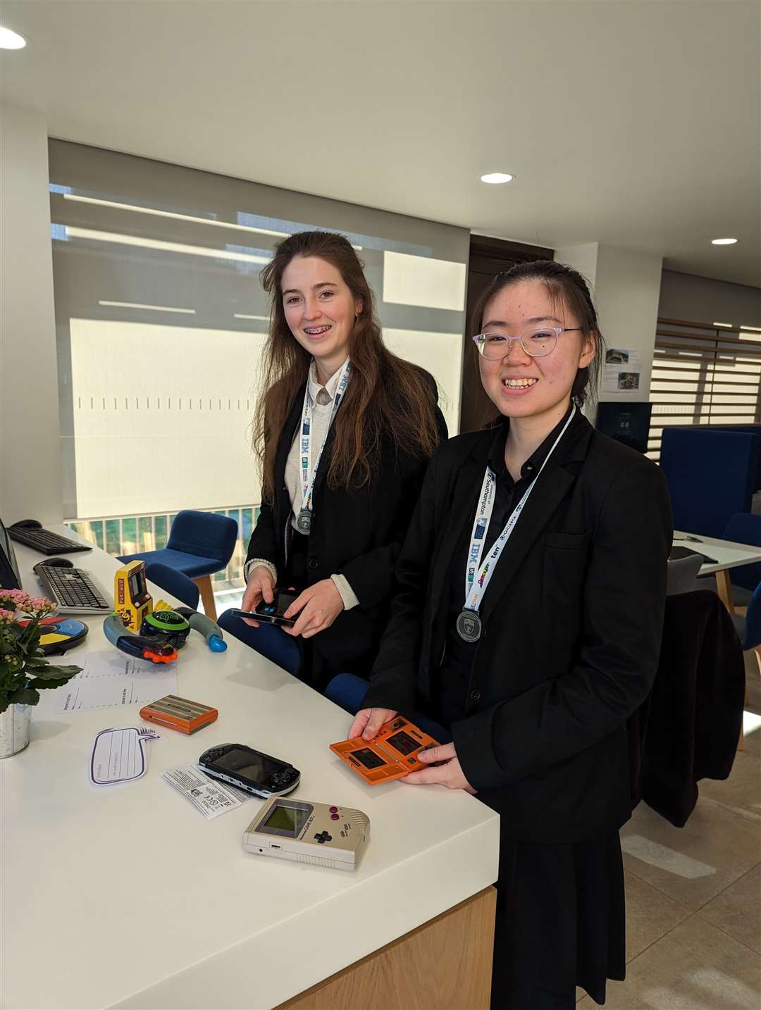 Dasha and Melinda with vintage computer games on display in the school's Murray Centre