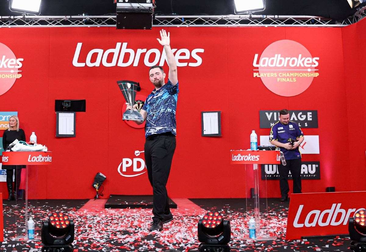 Luke Humphries celebrates retaining the Players Championship, after defeating Luke Littler - Photo: Kieran Cleeves/PDC