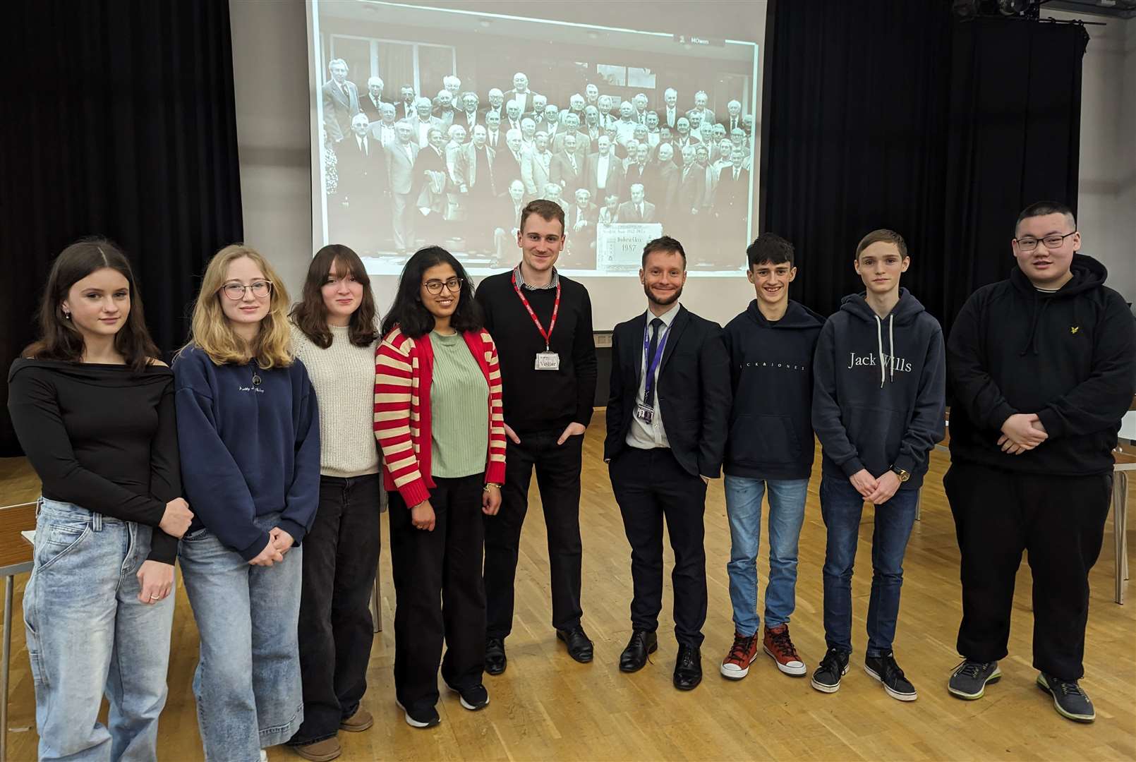 NWN reporter Mirek Gosney and sixth form house leader Mark Owner with St Bart's Year 12 students. Credit: Laura Wrzesinski