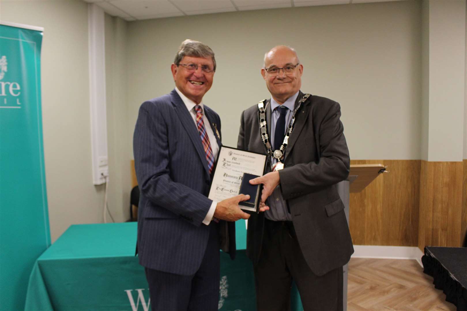 Graham Pask receives his long service award from chairman Jeremy Cottam