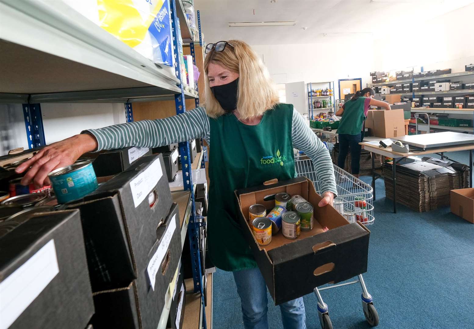 Volunteers have been busy packing parcels to be sent out. Ref: 28-2021