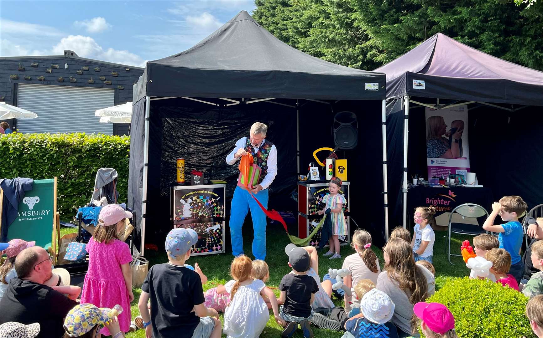 Magician entertaining younger visitors