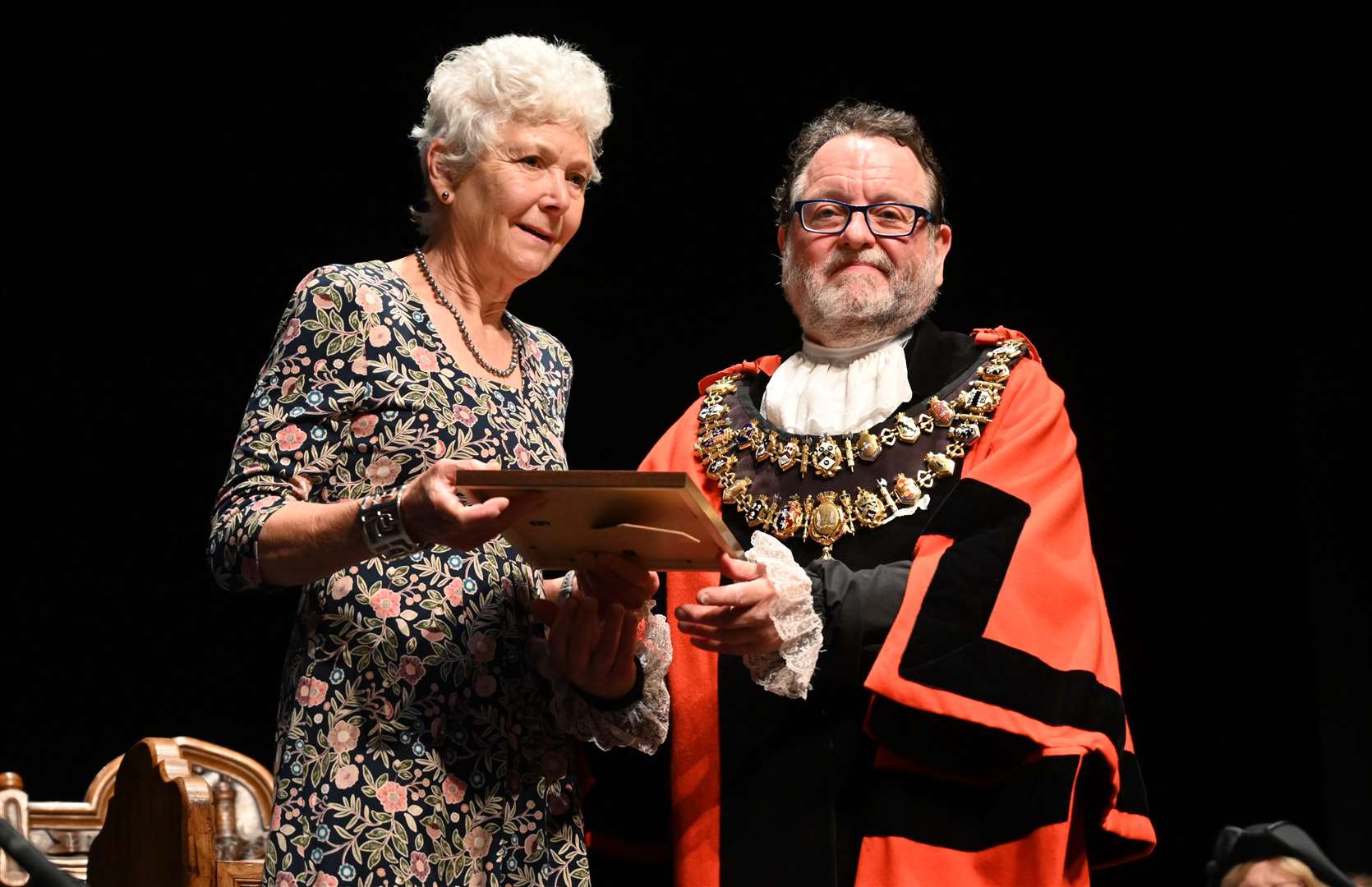 Outgoing mayor Gary Norman presenting a long service award to councillor Sue Farrant