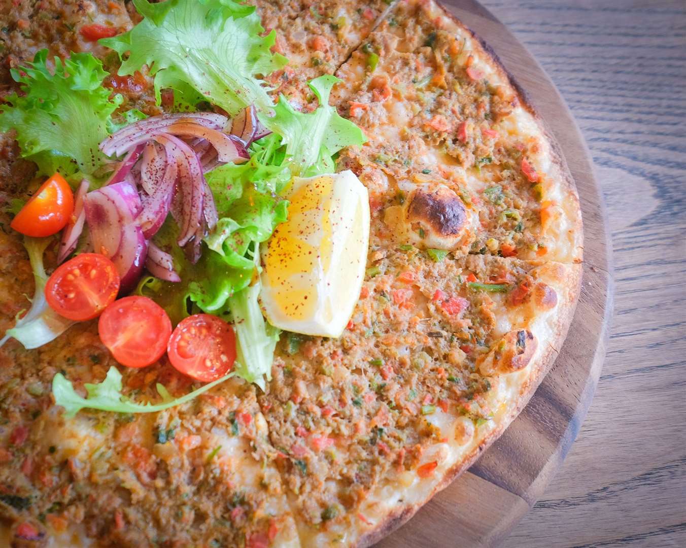 Kusbasili Pide. Diced lamb cubes, peppers, tomotoes, onion and parsley