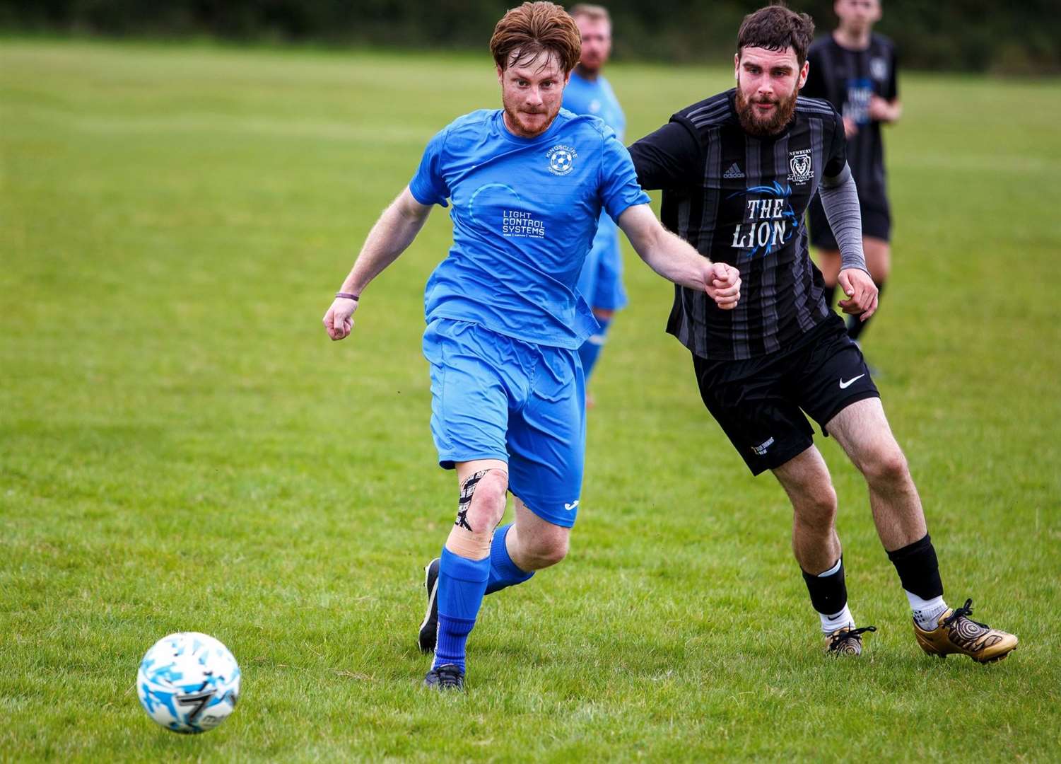 Kingsclere (blue) face former league members Newbury Lions - Photo: Wilf Springer