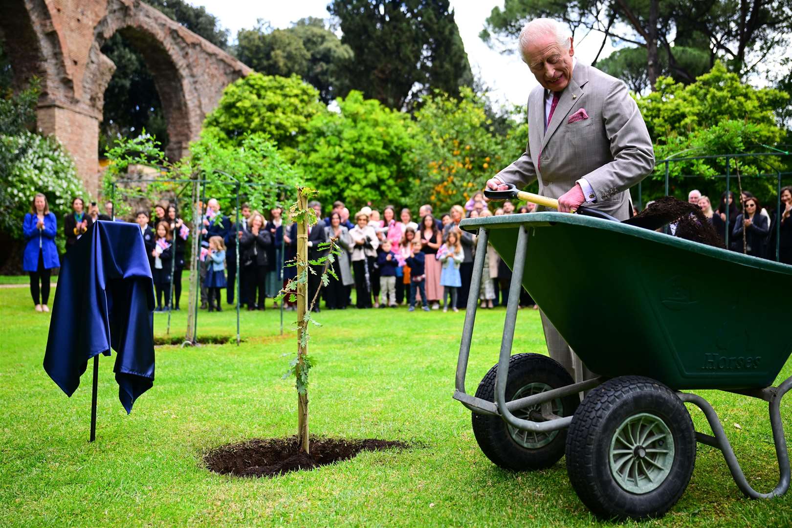 Charles planted a tree donated by Italian President Sergio Mattarella from the Castelporziano Estatein in the gardens of the ambassador’s residence, Villa Wolkonsky, in Rome (Victoria Jones/PA)
